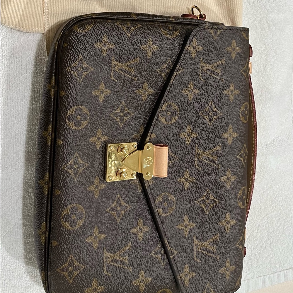 Louis Vuitton Monogram Clutch with Gold Accents